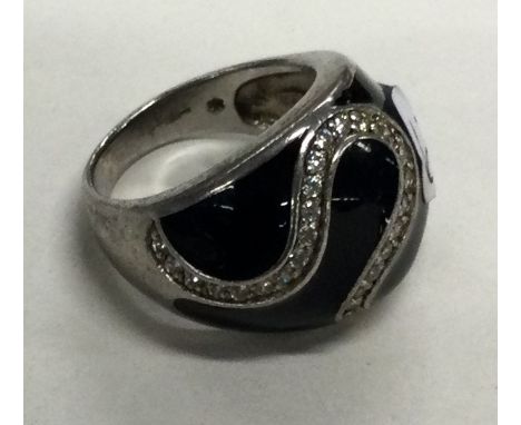 A silver and enamelled ring. Approx. 9 grams. Est. £10 - £20.