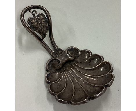 A Victorian silver caddy spoon with cast leaf handle. Birmingham 1857. By Brown & Clark. Approx. 13 grams. Est. £80 - £120.