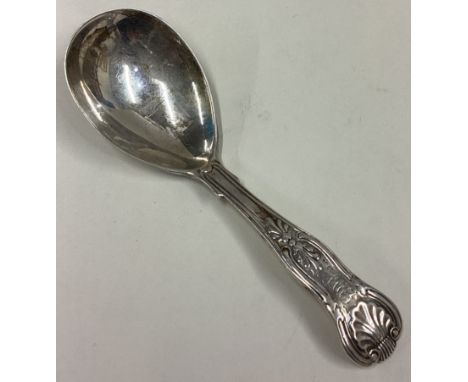 A large silver honeysuckle pattern caddy spoon. London. By GA. Approx. 29 grams. Est. £30 - £50.