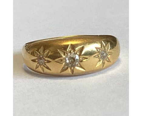 A good diamond three stone gypsy set ring in 18 carat gold mount. Approx. 4 grams. Est. £150 - £200.