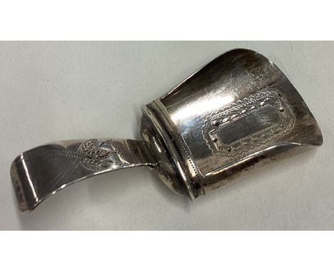 A George III silver caddy spoon with bright-cut decoration. Birmingham 1806. By Cocks & Bettridge. Approx. 7 grams. Est. £50 