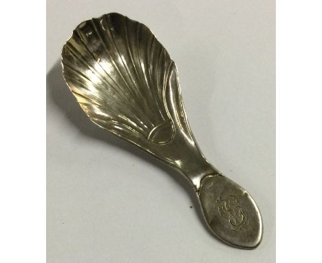 An 18th Century George III silver fluted caddy spoon. Sheffield 1789. Approx. 8 grams. Est. £30 - £40.