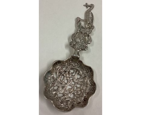 An attractive Continental silver caddy spoon decorated with a stork. Approx. 20 grams. Est. £20 - £30.