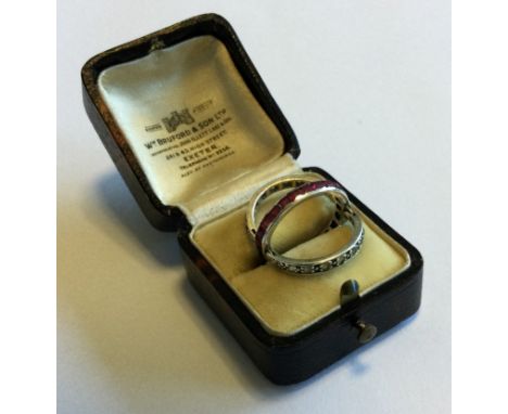 A sapphire, ruby and diamond hinged 'night and day' ring set in platinum. Approx. 4 grams. Est. £250 - £300.