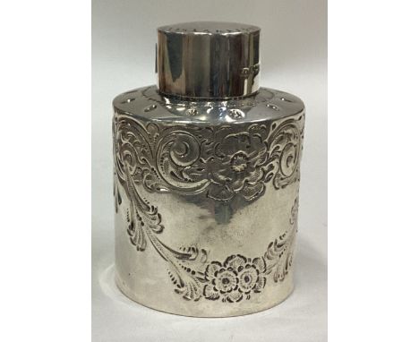 A cylindrical silver tea caddy with chased decoration. Sheffield. By HA. Approx. 62 grams. Est. £50 - £80.