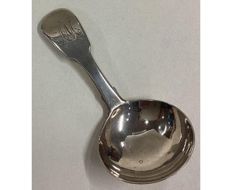 A good silver fiddle pattern caddy spoon of plain form. London. By WB. Approx. 15 grams. Est. £30 - £50.