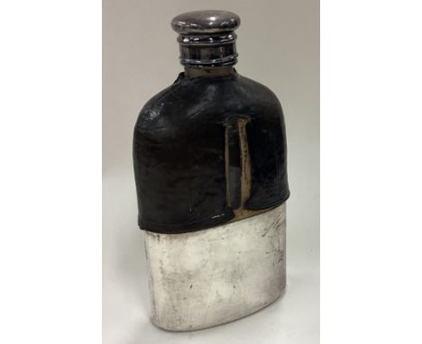 A silver plated and glass flask with screw-top lid. Est. £20 - £30.