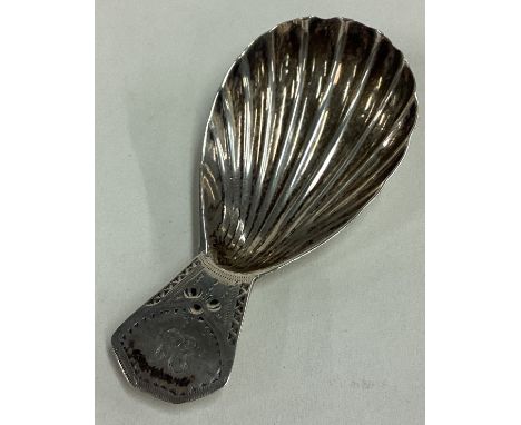 A George III silver caddy spoon with fluted bowl. London 1831. By Charles Harle. Approx. 9 grams. Est. £30 - £40.
