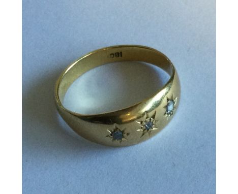A small diamond three stone gypsy set ring. Approx. 2 grams. Est. £100 - £150.