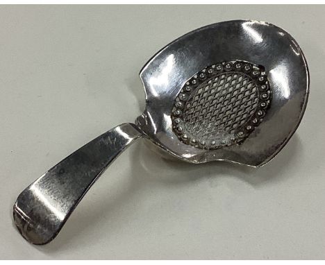 A George III silver caddy spoon with pierced decoration. Birmingham 1808. Approx. 7 grams. Est. £60 - £80.