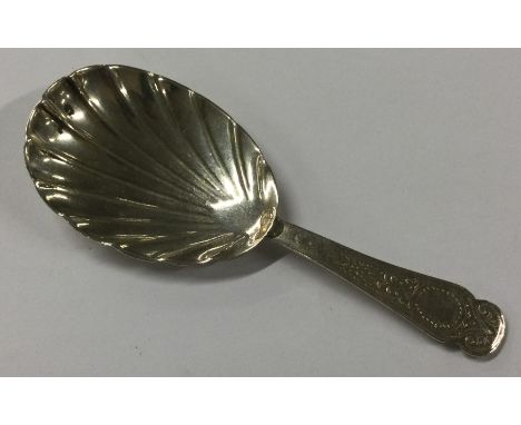 EDINBURGH: A Georgian Scottish silver caddy spoon with fluted bowl. Circa 1820. Approx. 13 grams. Est. £30 - £40.