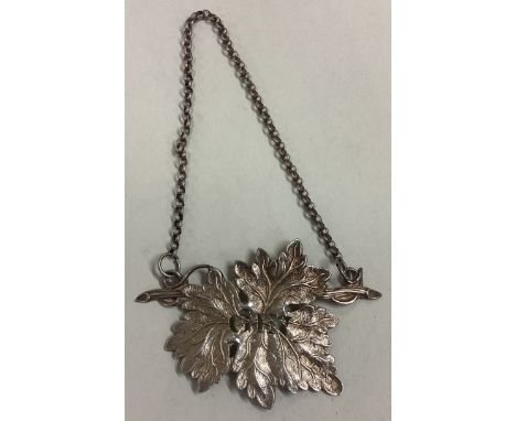 An attractive silver wine label for 'Gin'. Birmingham. By GU. Approx. 11 grams. Est. £30 - £40.