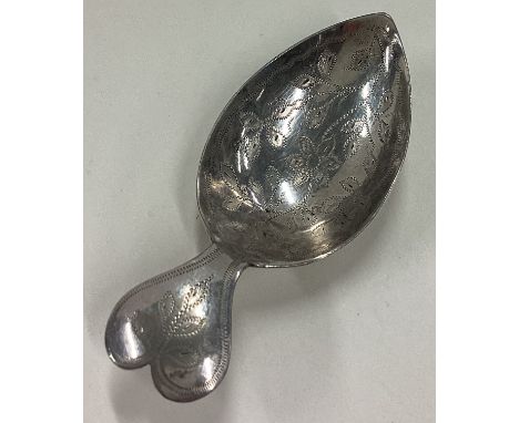 A heart shaped silver caddy spoon. Approx. 10 grams. Est. £30 - £40.