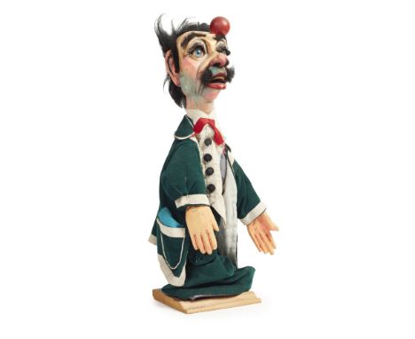 FERRARI FAMILY TROUPE, ITALY (FOUNDED 1892)  PUPPET OF BARGNOCLA, 1950S   painted wood and fabric  50cm x 15cm x 15cm Note: I