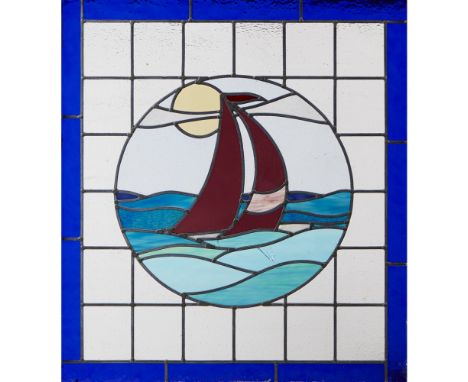 STAINED GLASS PANEL  CIRCA 1925   depicting a yacht on the ocean and enclosed within painted hardwood frame  94cm x 98cm