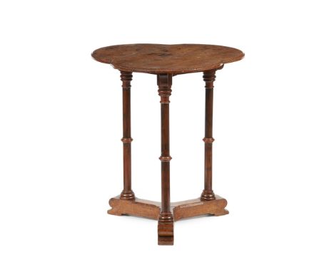 A GOTHIC REVIVAL OAK LAMP TABLE, ATTRIBUTED TO CHARLES BEVAN  CIRCA 1870   the trefoil top with dentil edge above three ring-