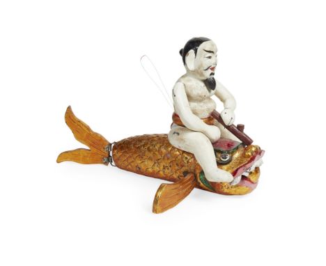 TWO VIETNAMESE WATER PUPPETS  19TH AND 20TH CENTURY   painted wood and fabric, comprising TEN (clown) riding on a fish, 41cm 