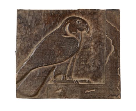 EGYPTIAN SCHOOL  HARDWOOD PANEL, CIRCA 1900   carved in bas relief with the profile of a falcon, probably representing the go