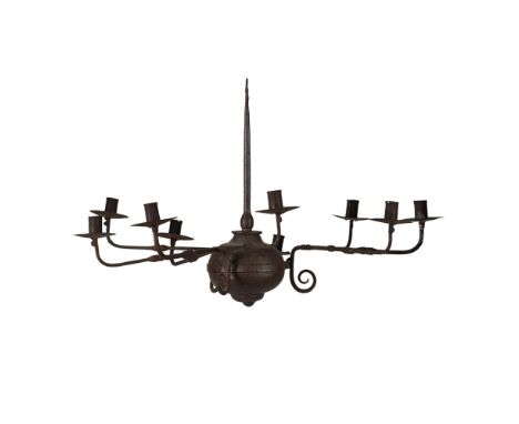 A WROUGHT IRON CHANDELIER  EARLY 19TH CENTURY  with three sets of three removable candle arms, supported by a bulbous finial 
