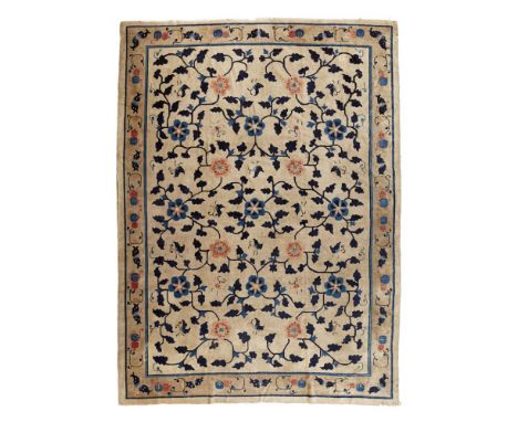 CHINESE CARPET  PROBABLY NINGXIA, 19TH CENTURY   the grey/cream field with allover rosette and foliate vine pattern, within g