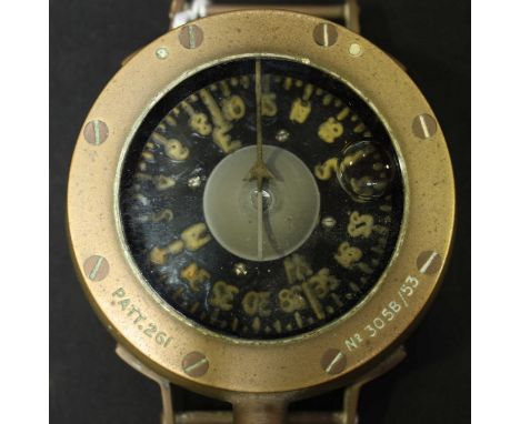 A Early/mid 20th Century brass divers wrist compass with black dial, front of case marked, 'PATT.261,' 'No. 305B/53.'