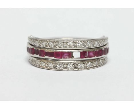 A diamond, ruby and sapphire hinged ring, set in white gold or platinum. Size J.
