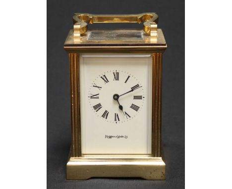 A contemporary brass Mappin & Webb carriage clock with white enamel dial and black Roman numerals. 13 cm high.