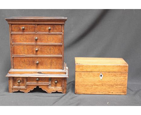 A Georgian oak miniature apprentice piece tallboy, with inlaid stars, the top inlaid with initials HC and 1726, over two shor