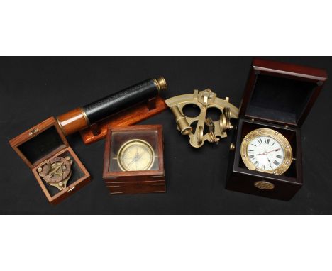 A reproduction brass sextant, together with a ships gimbal clock, two compasses and a telescope on stand. (5)