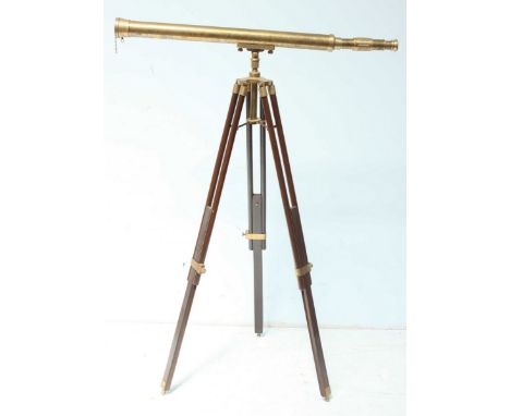 A modern brass telescope on adjustable folding stained wooden tripod stand, telescope 100cm long