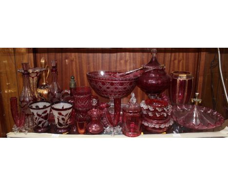 A quantity of Victorian cranberry and ruby glass including a pair of decanters, oval cut glass stemmed bowl, vases, beakers a