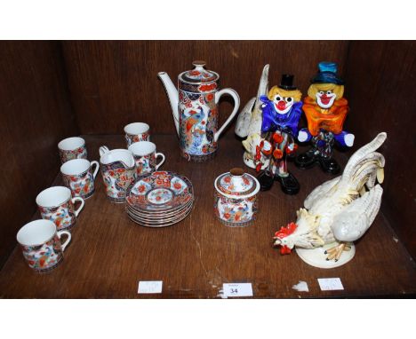 SECTION 34 - A pair of ceramic cockerels, two Murano glass clowns and a 15 piece Japanese coffee set.