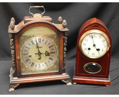 An early 20th century mahogany lancet-shaped mantel clock with 8-day movement striking a gong, Arabic numerals, together with