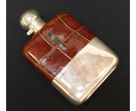 A George VI silver and glass hip flask, hallmarked Sheffield 1941, by James Dixon & Sons. with croc skin covering and removab