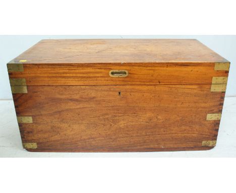 A large brass bound camphor wood trunk, with brass corner banding and brass carrying handles. 108 cm wide.