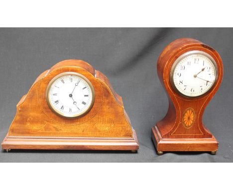 An Edwardian mahogany balloon clock with white enamel dial, together with a similar Edwardian mahogany mantel clock. (2)