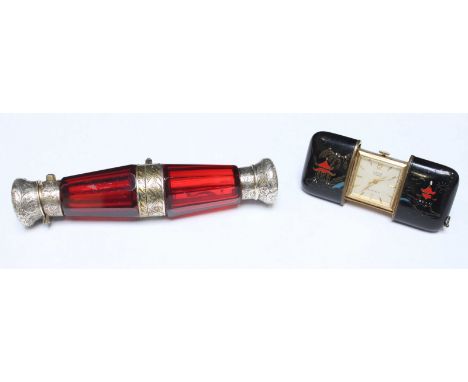 A double-ended hinged cranberry glass scent bottle with white-metal mounts, together with a 1950s miniature Laco travelling c