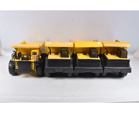 THREE MIGHTY TONKA TOYS DUMPER TRUCKS, three are the later versions with plastic chassis, with a similar smaller scale Buddy 
