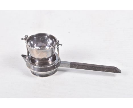 A 'GARRARD &amp; CO' SILVER TEA STRAINER, fitted with a wooden handle, hallmarked 'Garrard &amp; Co Ltd' London 1920, approxi