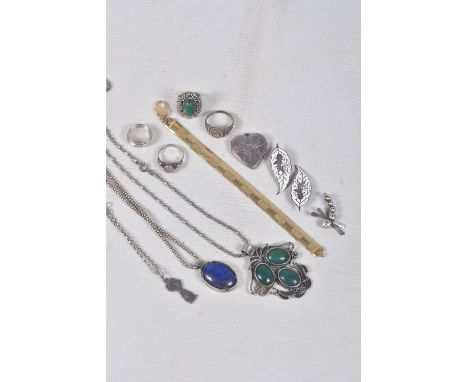 A BAG OF ASSORTED JEWELLERY, to include a large continental white metal green hardstone set pendant with fancy bead chain, a 