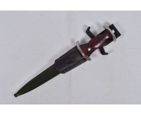 A GERMAN THIRD REICH NPEA DAGGER WITH SCABBARD, this has a double edged blade with the motto Mehr sein als scheinen and is cl