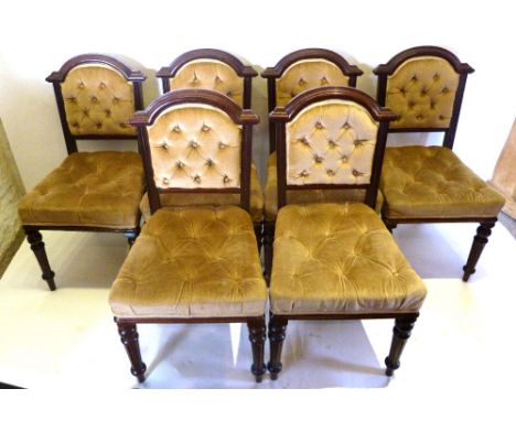 A Set of Six Victorian Mahogany Dining Chairs, each with a shaped partly button upholstered back above a button upholstered s