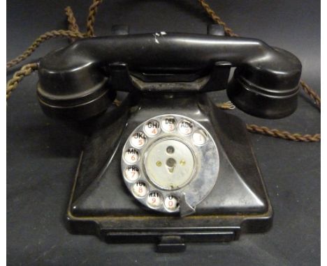 A Black Bakelite Telephone with Enamel Dial