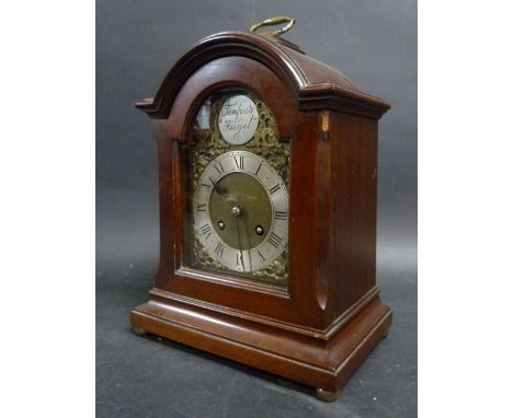 An Early 20th Century Mahogany Cased Bracket Clock of Arched Form, the brass dial with silvered chapter ring and Roman numera