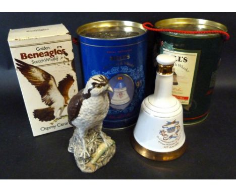A Golden Gleneagles Scotch Whiskey Decanter In The Form Of An Osprey, together with two Bells Scotch Whiskey decanters in can