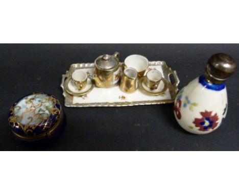 A Continental Porcelain Dolls' Tea Service upon a Tray, together with a small vinegar bottle and pill box