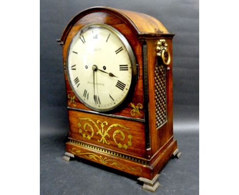 A Regency Rosewood and Brass Inlaid Bracket Clock of Arched Form with Ring Side Handles, the dial with Roman numerals and ins