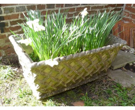 A Reconstituted Weathered Stone Planter, 94 x 56 cms