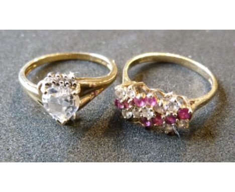 A 9ct. Gold Band Ring together with another similar 9ct. gold ring in the form of a heart