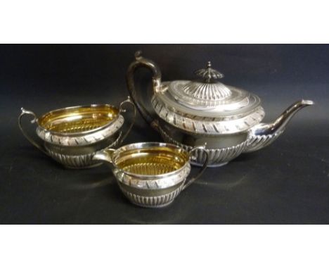 A Victorian Silver Three Piece Tea Service of Half Lobed and Engraved Form by Walker and Hall, Sheffield 1895, 33 ozs.